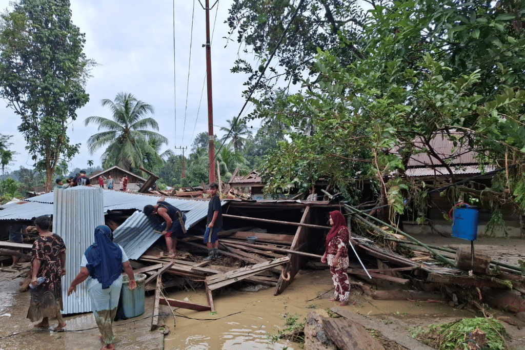 These photos, taken on November 28, show the aftermath of deadly floods in Aceh, an Indonesian province on the northwest tip of Sumatra Island.⁠