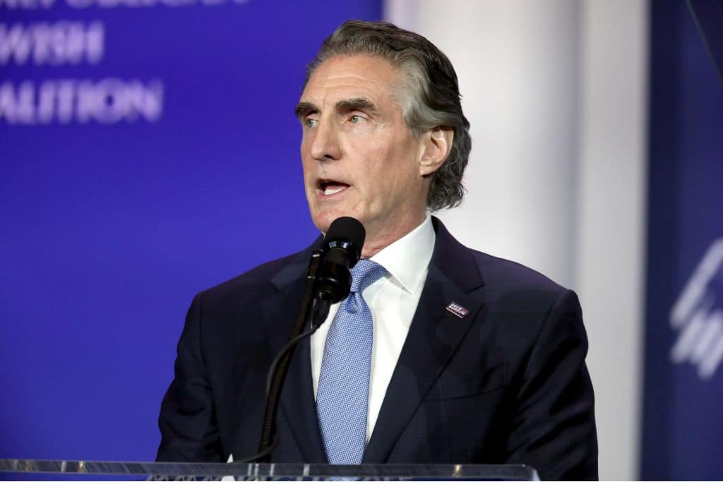 North Dakota Governor Doug Burgum speaking with attendees at the Republican Jewish Coalition's 2023 Annual Leadership Summit at the Venetian Convention & Expo Center in Las Vegas, Nevada.