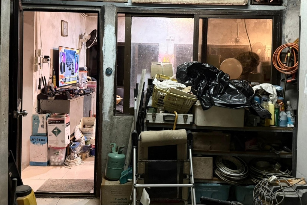 Villagers in Hong Kong use fans and leave doors open to keep cool as hotter nights become more common in the subtropical city.