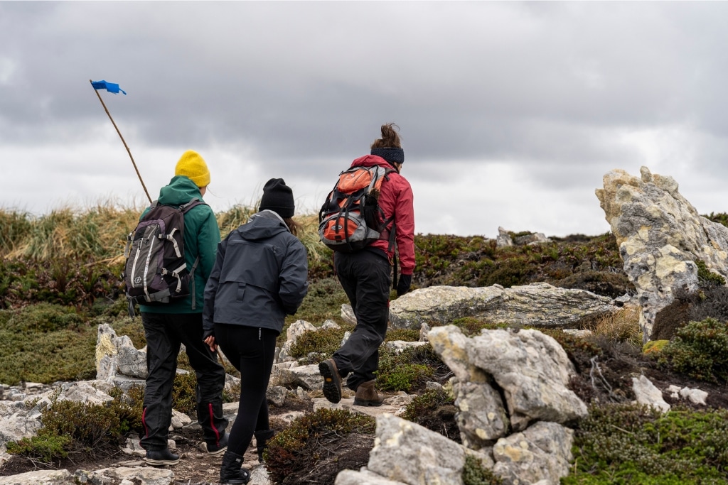 The Edges of Earth Expedition team trekking with the nonprofit, Falklands Conservation.