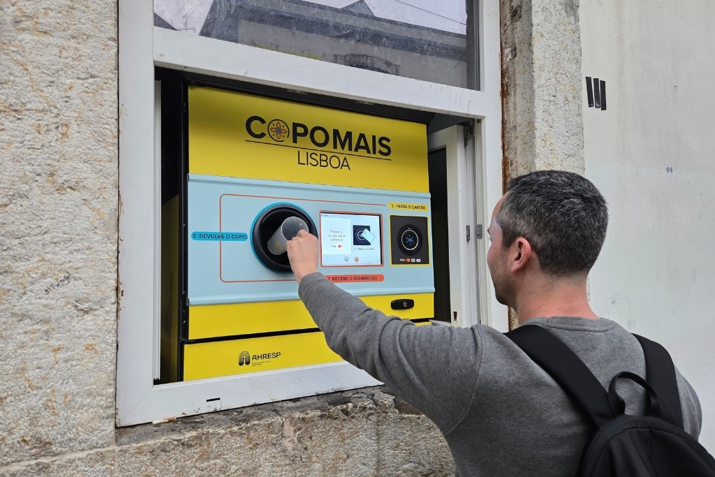 A CopoMais customer returns an empty cup at an automated machine in Lisbon, Portugal.
