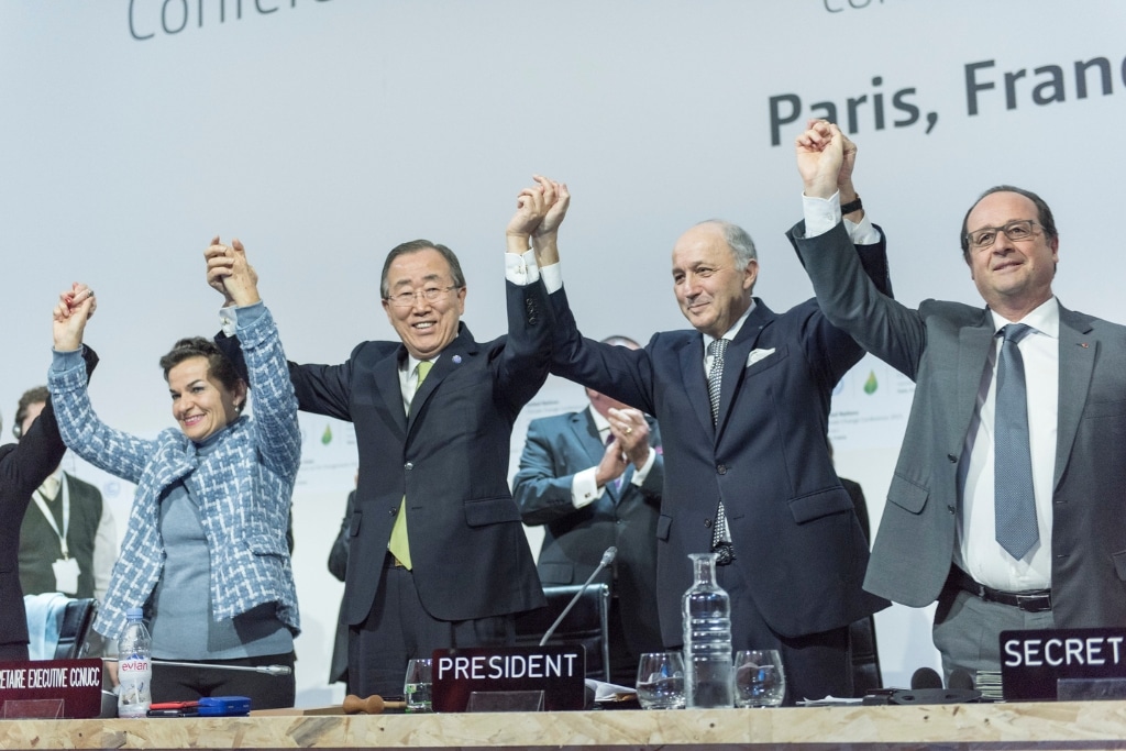 Secretary-General Ban Ki-moon (second left); Christiana Figueres (left), Executive Secretary of the UN Framework Convention on Climate Change (UNFCCC); Laurent Fabius (second right), Minister for Foreign Affairs of France and President of the UN Climate Change Conference in Paris (COP21) and François Hollande (right), President of France celebrate after the historic adoption of Paris Agreement on climate change.