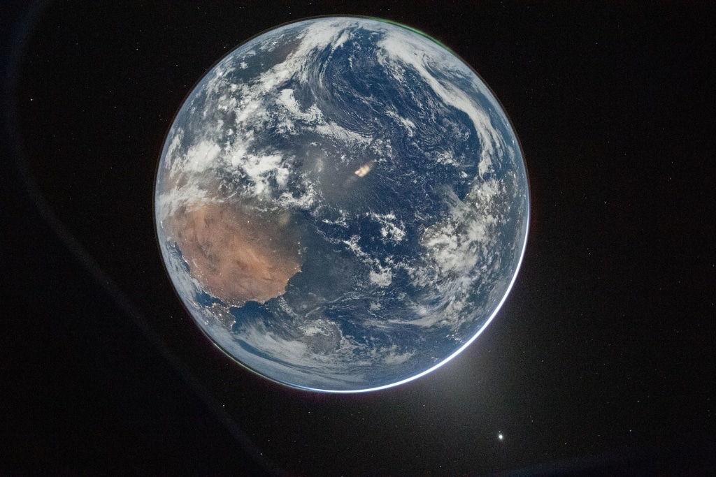 This nighttime picture of Earth was taken on April 2, 2026, by an Artemis II crew member aiming a camera through a window of the Orion spacecraft.